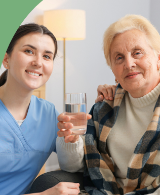 Caregiver assisting elderly woman